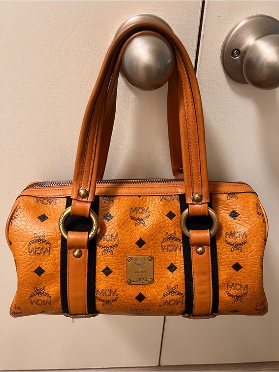 MCM Handbags - MCM Cognac Monogram Barrel Satchel with Gold Hardware
